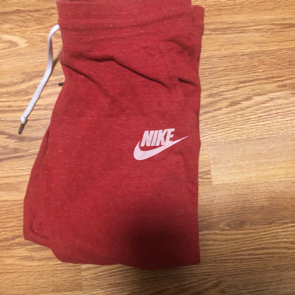 Red Nike joggers